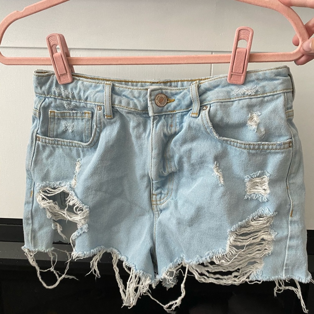 Distressed light wash denim shorts